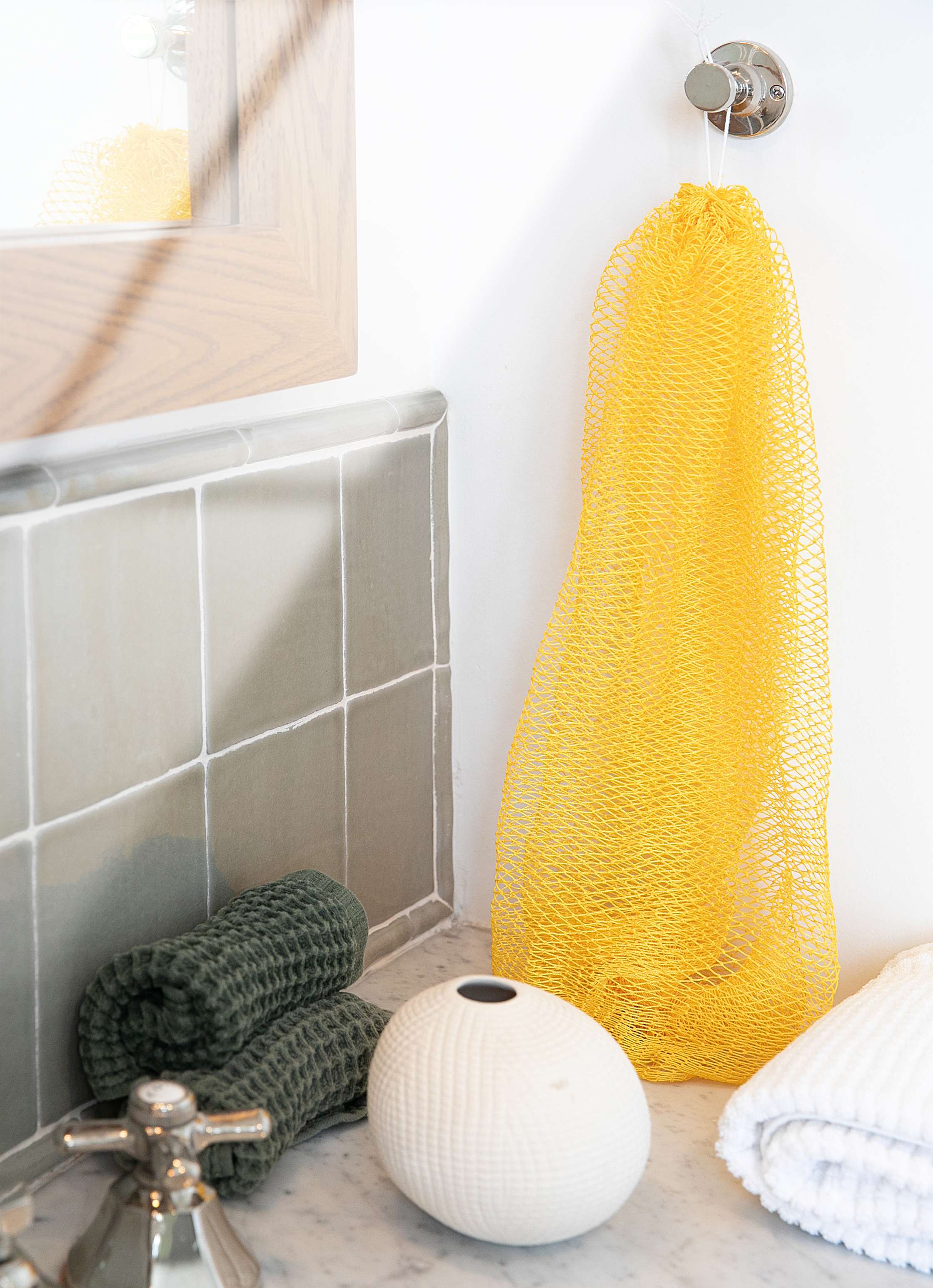 Bellanomi African Exfoliating Net Sponge 45 inches long hanging dry in the bathroom